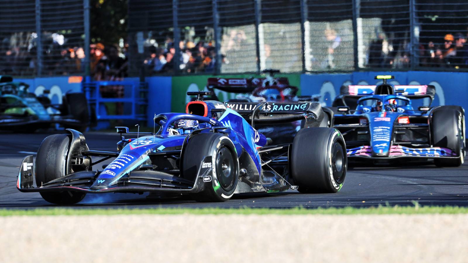 Alex Albon ahead of an Alpine in Australia. Melbourne April 2022.
