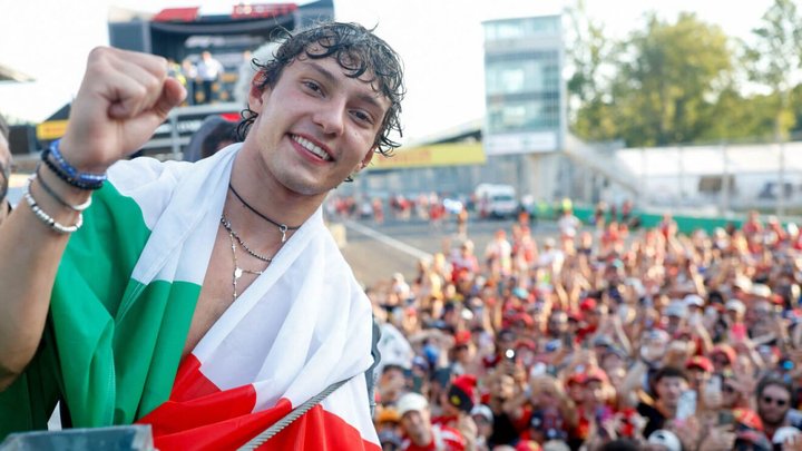Kimi Antonelli smiling with the Italian fans behind him
